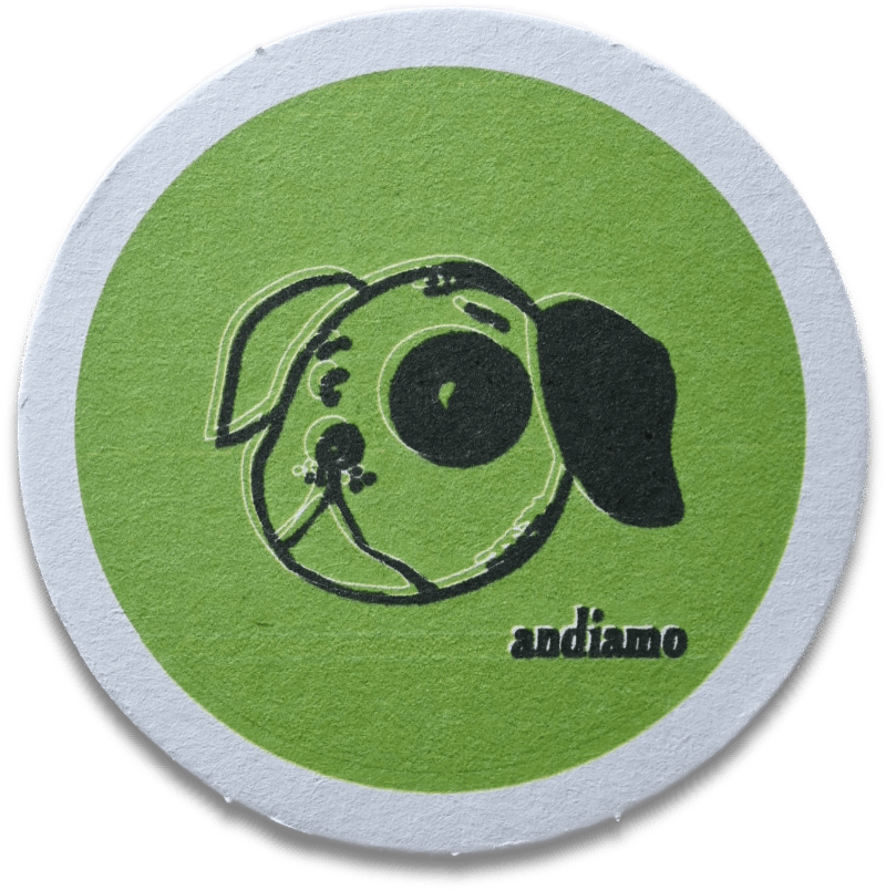 A coaster showing the famous dog on a green background with the word Andiano below the dog's face