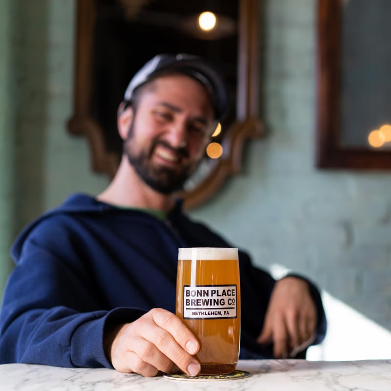 Sam out of focus with a beer